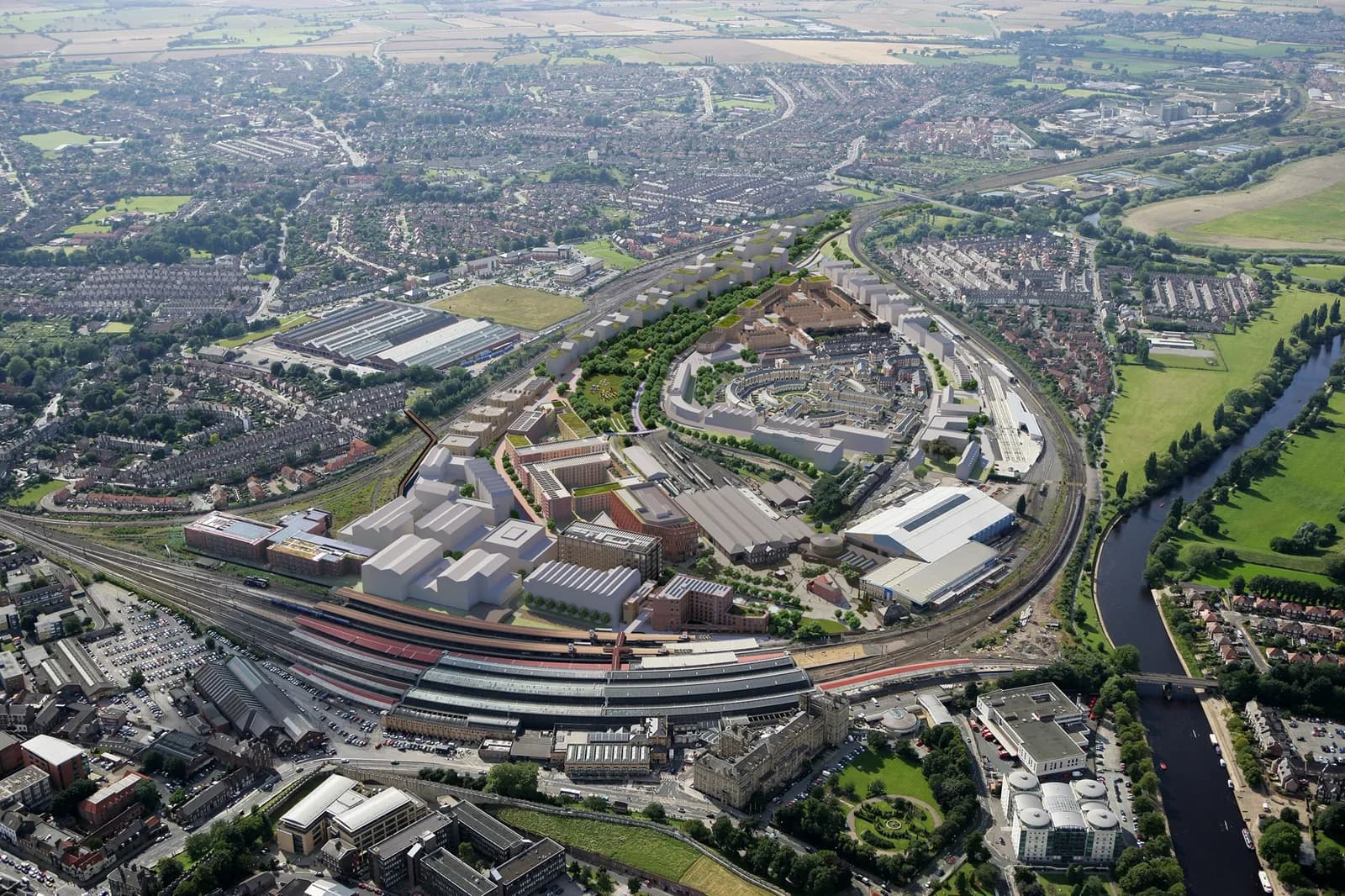 An aerial view showcases a bustling cityscape with a prominent curved railway station at the forefront, surrounded by a mix of residential areas, green spaces, and a river winding through the landscape.