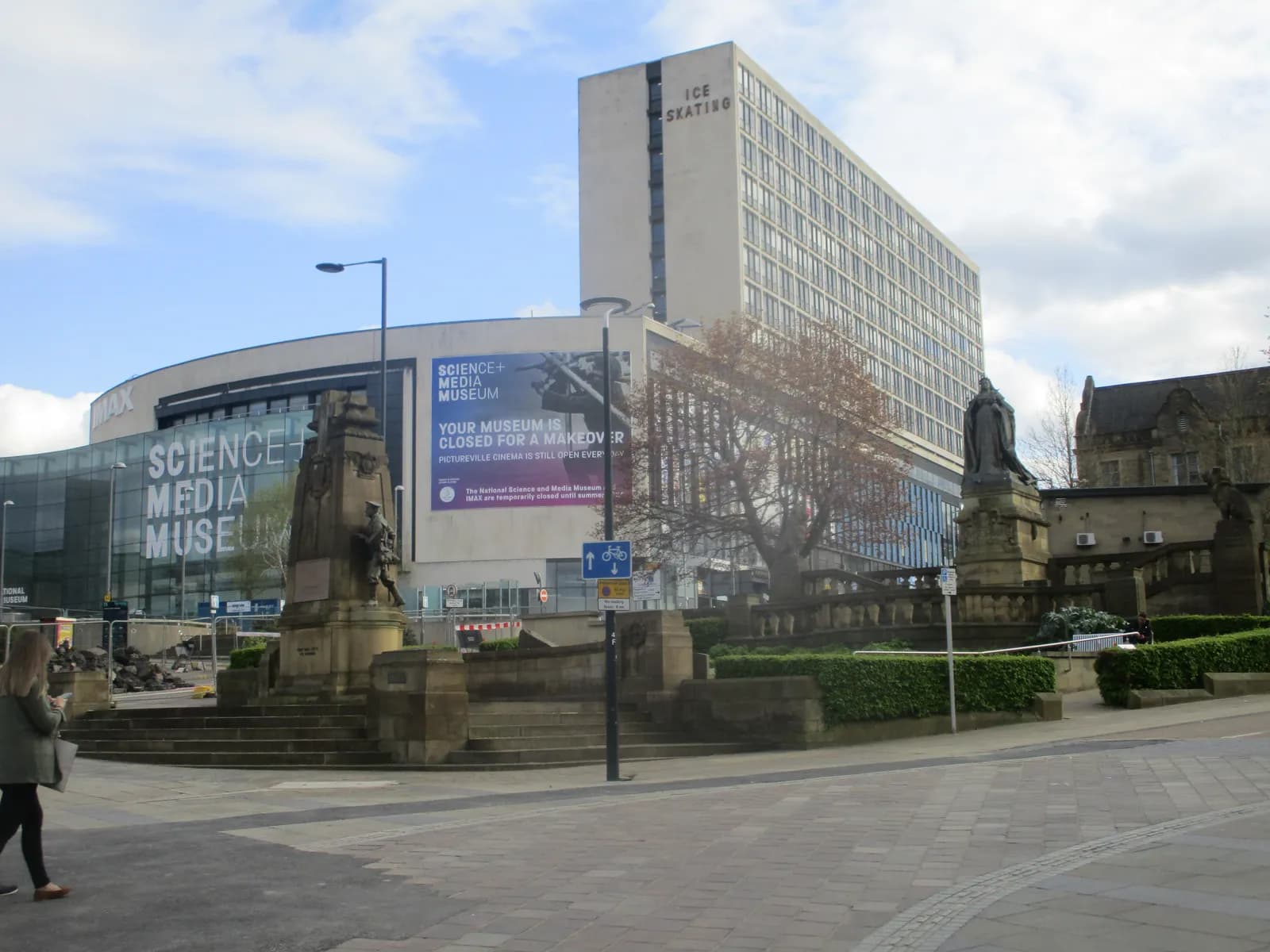 The Science and Media Museum is visible in the background, a large building with a banner stating it is closed for a makeover, with a tall building labeled ICE SKATING to its right.