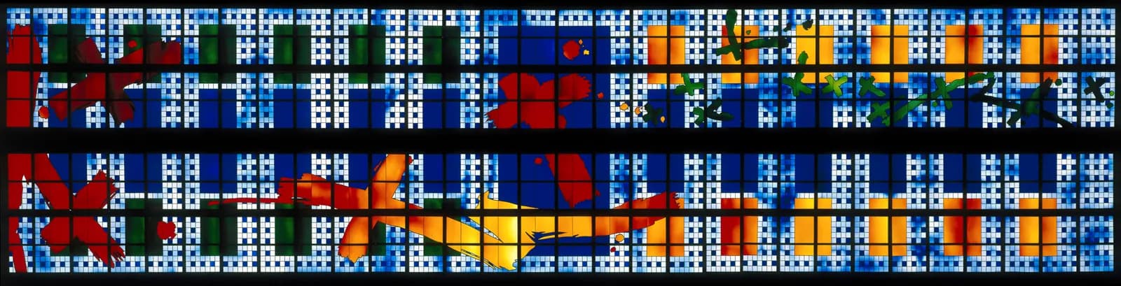 A long, panoramic stained glass window composed of two horizontal bands, with a grid of small light blue and white squares serving as a background for abstract shapes in red, orange, green, and darker blue.