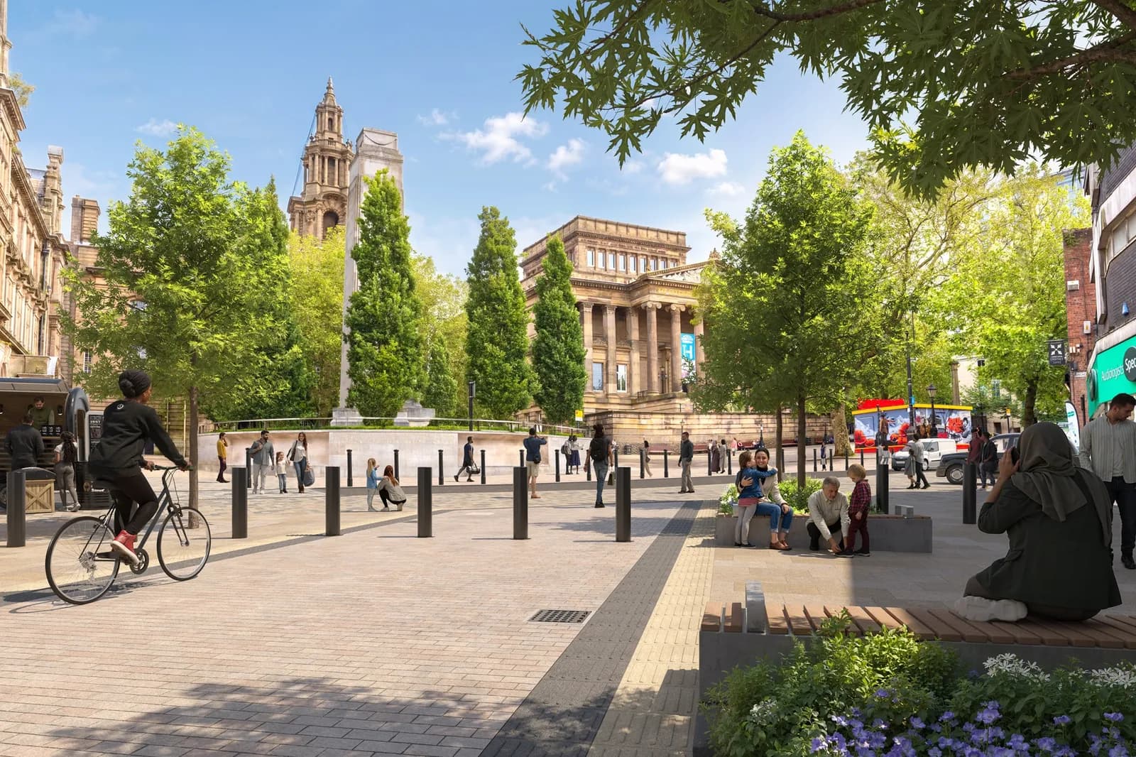 A bustling city square with people walking and cycling, surrounded by historic buildings and trees under a clear sky.