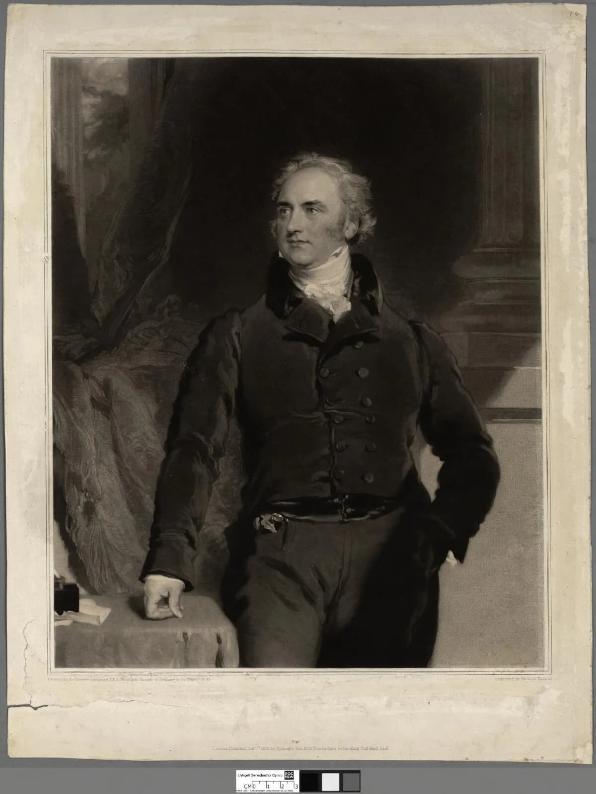 A black and white portrait of a man in 18th-century attire standing with one hand resting on a table and the other in his pocket, looking off to the left.